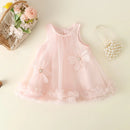 Pink baby dress with floral details on a light background, Obroi