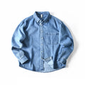 Obroi Blue denim shirt on a white background