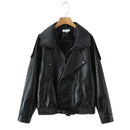 Obroi Black leather jacket on a wooden hanger against a white background