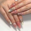 Close-up of hands with decorative nail art on a white background, Obroi