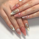 Close-up of hands with decorative nail art on a white background, Obroi