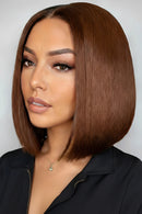 Woman with styled brown hair against a plain background, featuring the brand 'Obroi'.