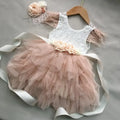 Pink and white dress with floral details on a gray background, Obroi