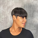 Woman with a stylish black haircut against a neutral background, Obroi