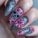 Nails with black and pink floral design on a neutral background, Obroi