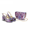 Pair of colorful high-heeled shoes with a matching handbag on a white background, featuring the brand 'Obroi'.