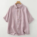 Pink button-up shirt on a wooden hanger against a white background, Obroi