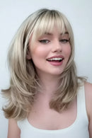 Person with blonde hair and a close-up of a blonde hair extension, Obroi