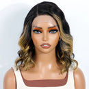 A wavy lace-front wig with dark brown roots and golden blonde highlights, styled on a female mannequin bust, Obroi