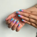 Hands with pastel gradient nail art on a plain background, Obroi