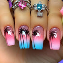 Nails with palm tree design and gradient colors, featuring rings on fingers, Obroi