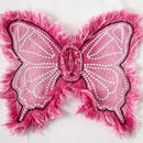 Pink butterfly patch with frayed edges on a white background, Obroi