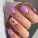 Hand with pink and purple nail design on a neutral background, Obroi