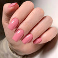 Hand with pink nail polish on a neutral background, Obroi