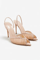 Pair of high-heeled shoes with embellishments on a white background, Obroi