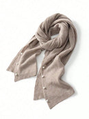Beige knitted scarf with pearl embellishments on a white background, Obroi