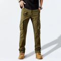 Person wearing olive green cargo pants on a white background, Obroi