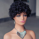 Mannequin head with a black curly wig and silver necklace on a blurred background, Obroi