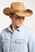 Man wearing a straw cowboy hat on a plain background, Obroi