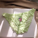 Light green lace underwear with a pink peach emblem on a white surface, Obroi