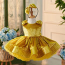 Yellow dress on a mannequin with a blurred background, Obroi