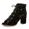 Black suede lace-up boot with gold studs on a white background, Obroi