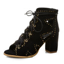 Black suede lace-up boot with gold studs on a white background, Obroi