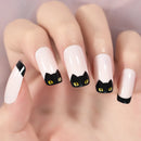 Nails with black cat face design on a light background, Obroi