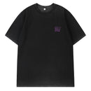 Black t-shirt with a small logo on the chest against a white background, Obroi