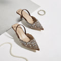 Pair of embellished high-heeled shoes on a light background, Obroi