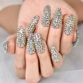 Nails with rhinestone embellishments on a neutral background, Obroi