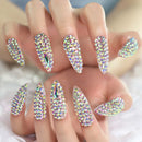 Nails with rhinestone embellishments on a neutral background, Obroi