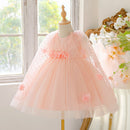 Pink dress on a mannequin in a bright room with flowers and a window, Obroi