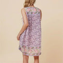 Woman wearing a floral dress on a beige , Obroi