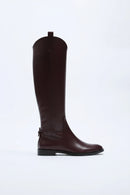 Black knee-high boot on a white background, Obroi