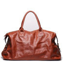Brown leather handbag on a white background, Obroi