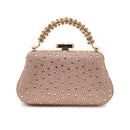 Rose gold handbag with crystal embellishments on a white background, Obroi