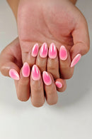 Close-up of a hand with pink nail polish on a light background, Obroi
