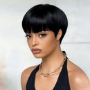 Woman with a stylish haircut wearing a black top and gold necklace against a white background, Obroi