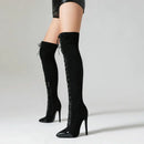Black knee-high boots with high heels on a neutral background, Obroi