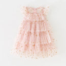 Pink tiered dress with gold star patterns on a white background, Obroi