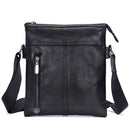 Obroi Black leather crossbody bag with a strap on a white background