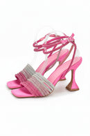 Pink high-heeled sandals with clear straps on a white background, Obroi