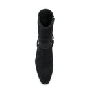 Black boot with a strap on a white background, Obroi