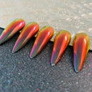 Obroi Multicolored metallic nail art tips on a textured surface