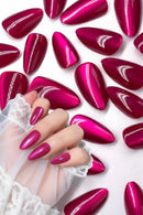 Hand with pink stiletto nails surrounded by additional pink nails on a white background, Obroi