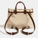 Beige handbag with brown leather straps on a white background, Obroi