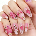 Nails with pink floral and decorative designs on a white background, Obroi
