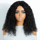 Black curly wig on a mannequin head against a white background, Obroi