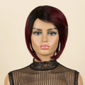 A Obroi 100% human hair wig with a short, layered bob cut, featuring a dark brown root color that transitions into deep burgundy red at the ends, displayed on a mannequin head against a solid beige background, Obroi